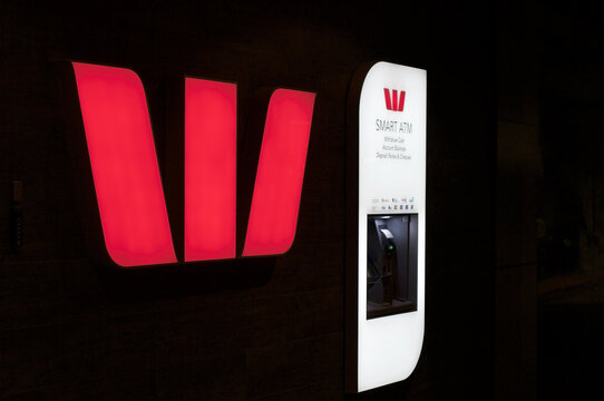 Illuminated Westpac Bank sign at building in Brisbane, Australia