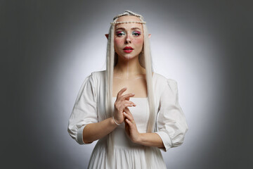 Naklejka premium Beautiful elf girl on grey gradient background