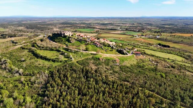 Aerial view of the historic stone ruins and green hills of Figueira de Castelo Rodrigo, Guarda District, Portugal.