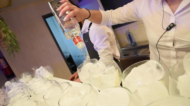 Serving Gin in Glass &ndash; Premium Bar Cocktail Pouring Close Up