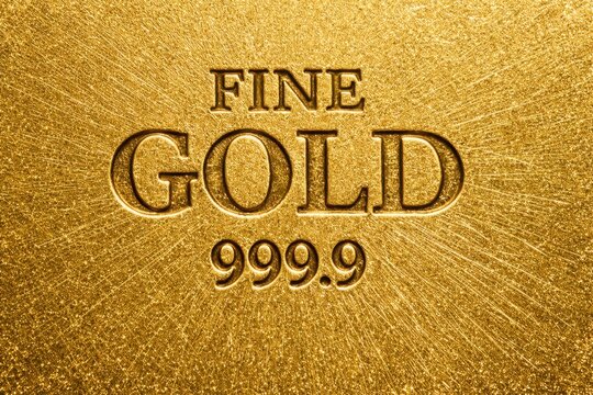 Gold Bar Texture. 999.9 Fine Gold Bar Texture. Pure Gold Bard. Luxury golden material pattern design. Realistic gold texture background. Trading and Business Investment Concept.