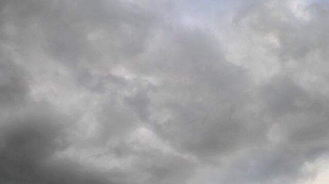 Dark stratocumulus clouds moving at twilight