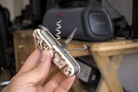 Zapopan Jalisco, Mexico - May 7, 2026:Victorinox Huntsman multi-tool with desert camouflage, victorinox knife concept