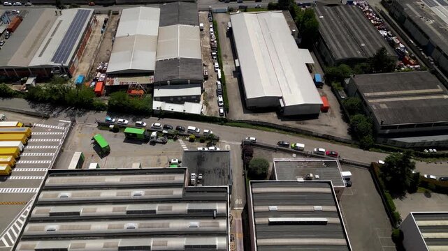 Industrial Landscape: An aerial perspective reveals an expansive industrial park, showcasing the efficient layout of warehouses, logistical operations, and the seamless flow of business activity.