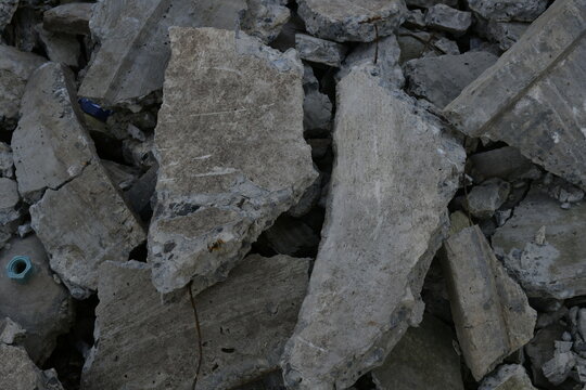 Top view of rubble and broken concrete blocks texture background in construction site.