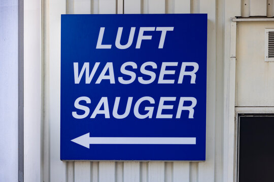 Gas station services guiding blue sign