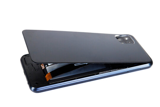 Smartphone back cover separating showing swolen battery