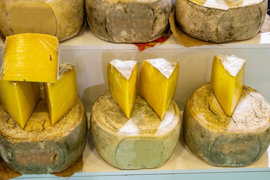 Various Turkish cheese on in diary production market. A lot of kind Turkish cheese  wheels on the shelves in diary production market. Food. Organic fresh chee se  skin and blocks of raw  in stainless 
