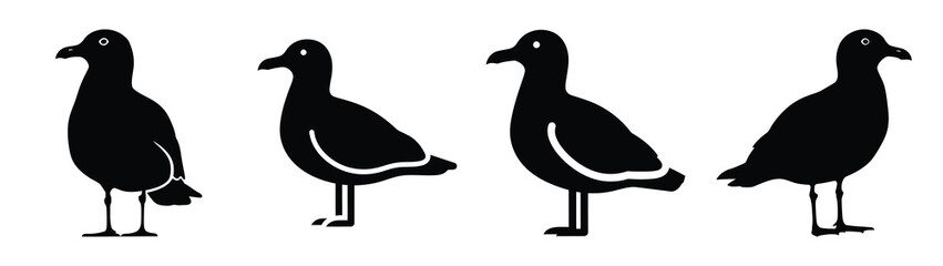 Fototapeta premium Collection of black summer seagull standing silhouette simple vector icon set and summer icons concept.