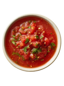 Isolated ceramic bowl with vibrant chunky tomato salsa and fresh green herbs, ready for dipping