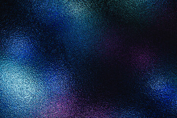 Dark frosted glass texture illuminated by vibrant neon blue and purple lights © Jess rodriguez