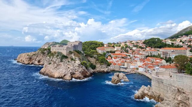 The historic Fort Lovrijenac on a rocky cliff and the blue Adriatic Sea in old town of Dubrovnik, Croatia, on a sunny day