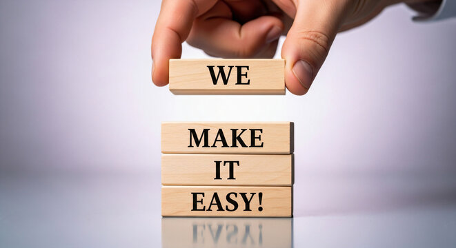 Hand Placing Wooden Block We Make It Easy Business Concept