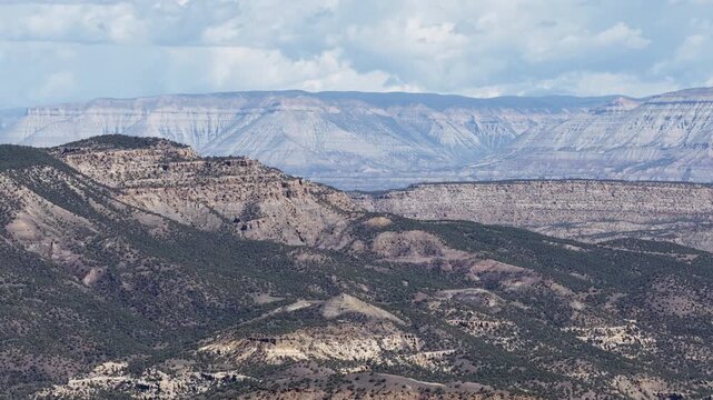 Zoom aerial of Book Cliffs high desert mountains in De Beque Colorado in spring