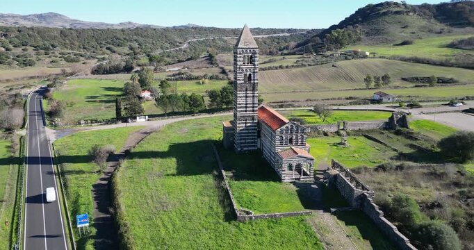 The Basilica della Santissima Trinita di Saccargia (Basilica of the Holy Trinity), a romanesque church in northern Sardinia, Italy. Entirely built with local black basalt and limestone.