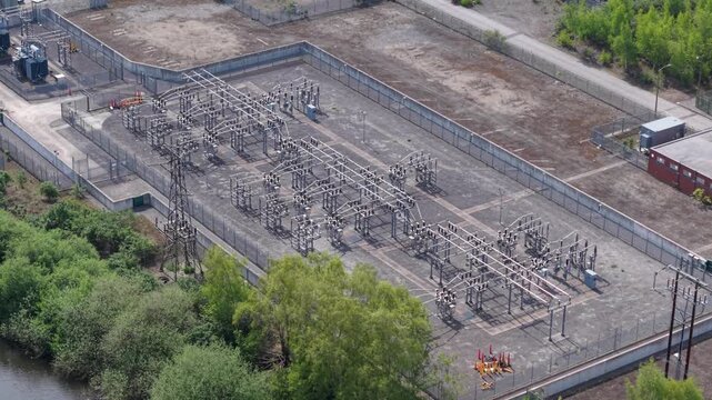 Aerial view of National Grid Ferrybridge A Substation showing the complex electrical infrastructure, transformers, and power lines surrounded by greenery in Knottingley, England, United Kingdom.