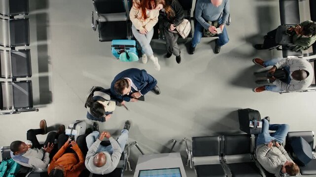 Sleeping, flight schedule screen and sisters in airport lounge next to people. Napping, display and family members in airplane departure terminal next to passengers looking at flight timetable