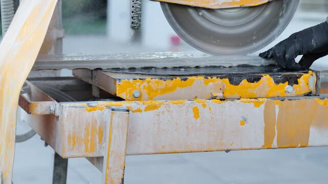Tile cutting.Construction tile cutting machine. Mechanical cutter for cutting hard materials. 4k footage
