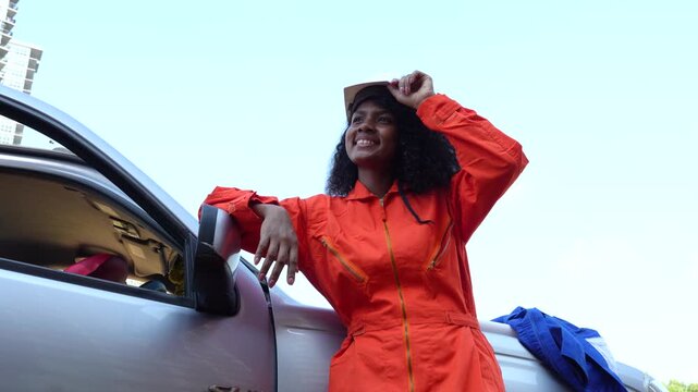 VDO 4K, A black female mechanical engineer in a safety uniform inspects and inspects piping systems for a new construction project of a large industrial building.	