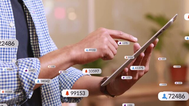 Hovering finger sparking badges growing, clustering, fading while man tapping tablet tracking stats