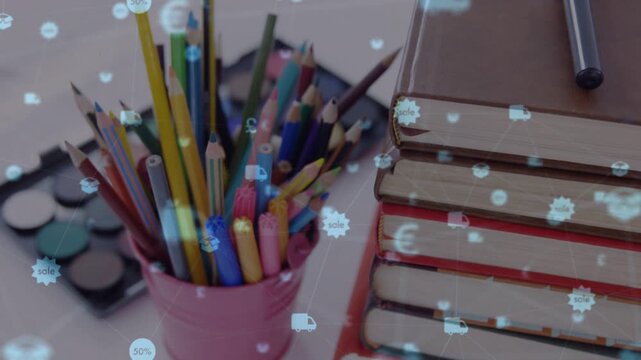 Overlay appearing pencil cup book stack getting drifting sale icons cam panning right showing sales