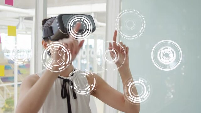 Woman wearing VR headset raising right index finger and initiating holographic UI, testing tech