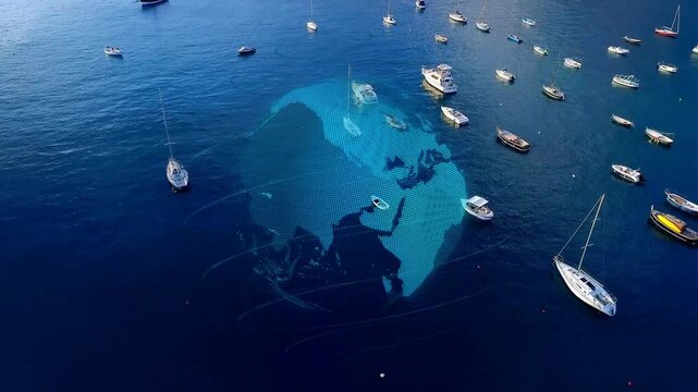 Aerial camera descending initiating dotted hologram globe rotating over bay, mapping boat positions