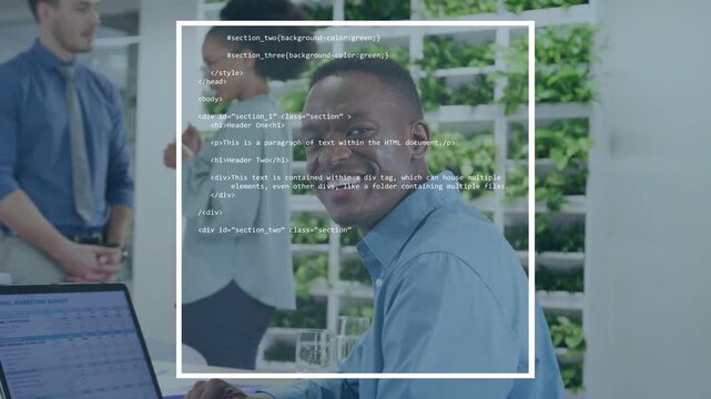 Man at laptop glancing up as animated code overlay building around him, smiling at success