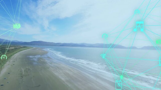 Camera panning along sandy coast, turquoise network fading in and drawing icons, showing connection