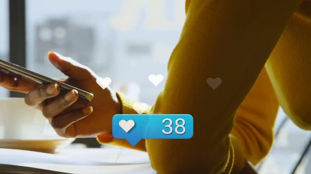 Blue heart popping at elbow, yellow sleeve hands shifting grip, scrolling, count rising for likes