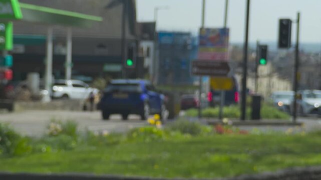 Traffic passing at junction on Black Boy Hill. Clifton Downs, Bristol, UK