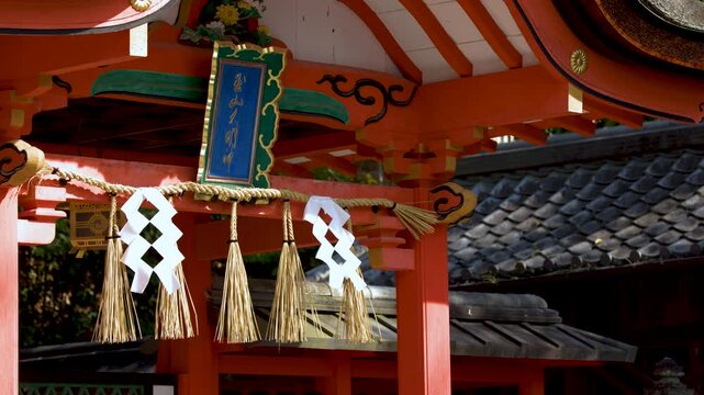 Traditional Shinto Shrine Gate with Shimenawa Rope and Shide Paper Streamers