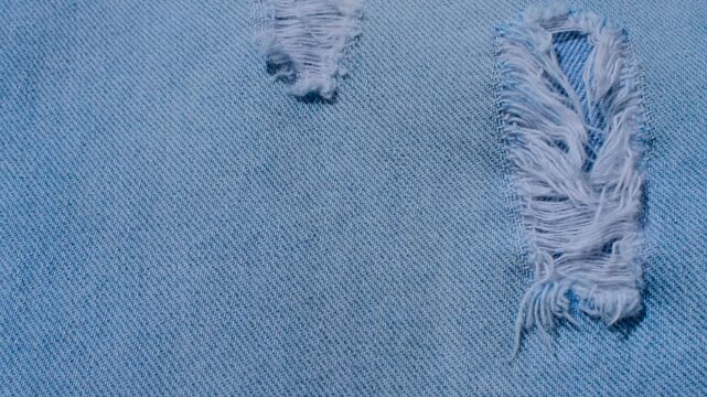 Detailed denim close-up, revealing the indigo blue texture and stitching, perfect for fashion and design projects.