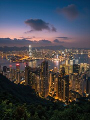 Obraz premium Cityscape Panorama Overlooking Vibrant Asian Metropolis at Dusk