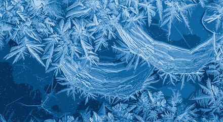 Abstract blue frost patterns and ice crystals in winter © kavi