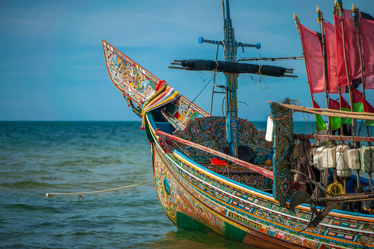 Perahu kolek are fishing boats with unique and colorful designs, found in southern Thailand.