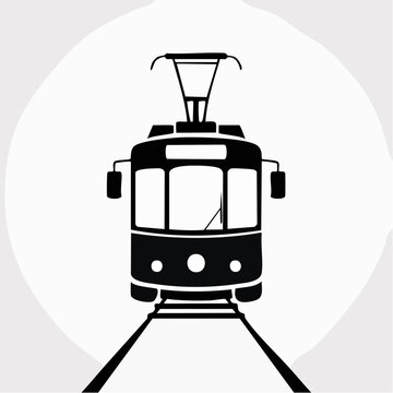 black silhouette of a vintage tram on train tracks