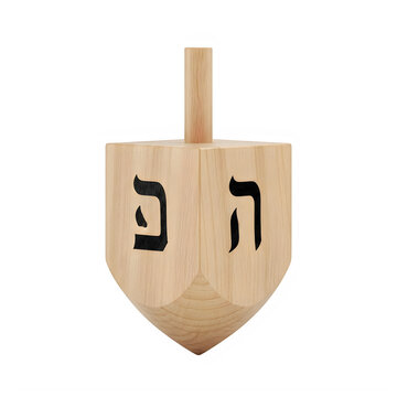 Traditional wooden dreidel with Hebrew letters