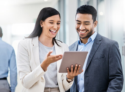 Laughing, reading or business people with tablet in hallway, show internet meme or watch funny video. Office, happy woman and man with tech for online corporate humor, meeting and social media joke