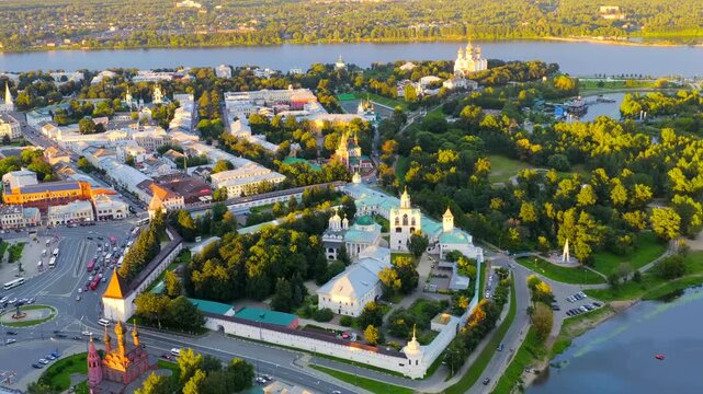 Yaroslavl, Russia. Spaso-Preobrazhensky Monastery, white stone walls and green domes, Drone footage at sunset over the Kotorosl River, historic Golden Ring cityscape. Drone footage