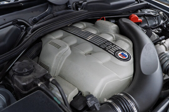 V8 engine of BMW ALPINA E63 B6 Under the bonnet sits a supercharged 4.4-litre V8, delivering 500hp, 516lb-ft of torque. Engine motor of BMW ALPINA E63, E64 B6 with emblem. BMW ALPINA E63, E64. 
