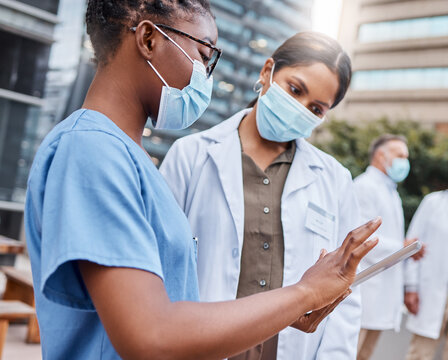 Doctor, people and research with mask, tablet and medical regulations for disease prevention in city. Healthcare, team and discussion on balcony with PPE, tech or collaboration for infection control.
