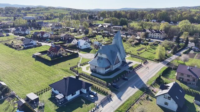 Architectural shot of a church surrounded by homes