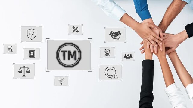 A group of diverse hands coming together represents teamwork and collaboration in business strategy and trademark protection, emphasizing unity and innovation in the workplace. Raster