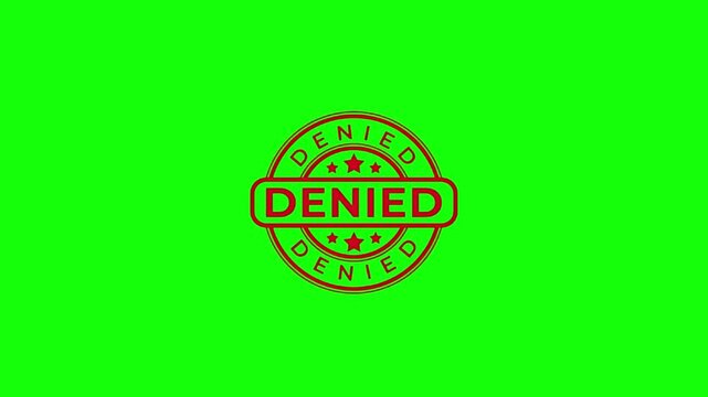 Red denied stamp on green background
