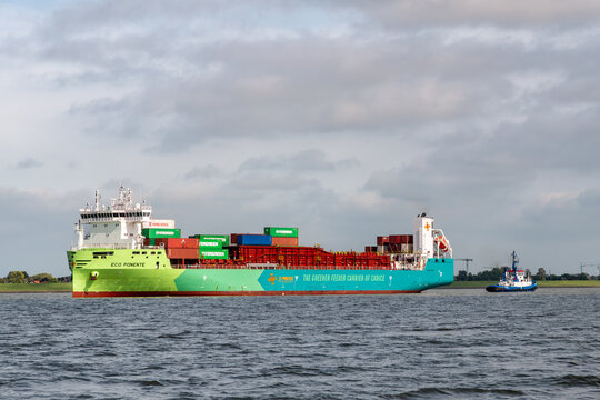 Modern eco-friendly container ship Eco Ponente on Elbe river, Schleswig-Holstein, Germany. This dual-fuel vessel uses green methanol to reduce carbon emissions in maritime transport