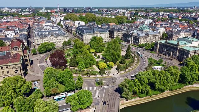Drone pulling back over Place de la R&eacute;publique with the Ill River, bridge, Palais du Rhin, National Library and National Theatre