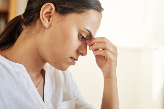 Creative, freelancer and woman with headache in house, stress and thinking with brain fog for novel. Author, remote work and person with migraine in home, exhausted and reflection on project deadline