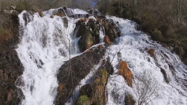Pristine Waters Cascading Over Rocks At Furelos River In Toques, Galicia, Spain. Aerial Shot