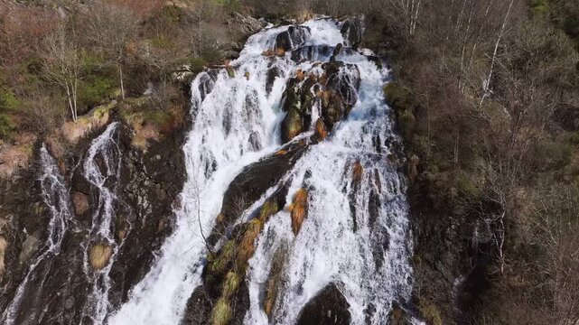 Rushing Waterfalls Over Rocky Mountains At Furelos River In Toques, Galicia, Spain. Aerial Rotate Shot